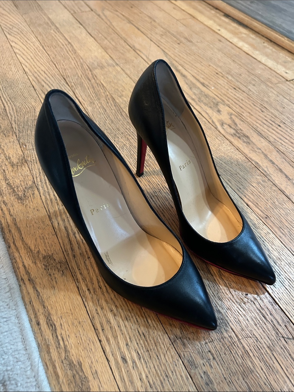 Christian Louboutin Black Leather Pointed Pumps with Red Sole